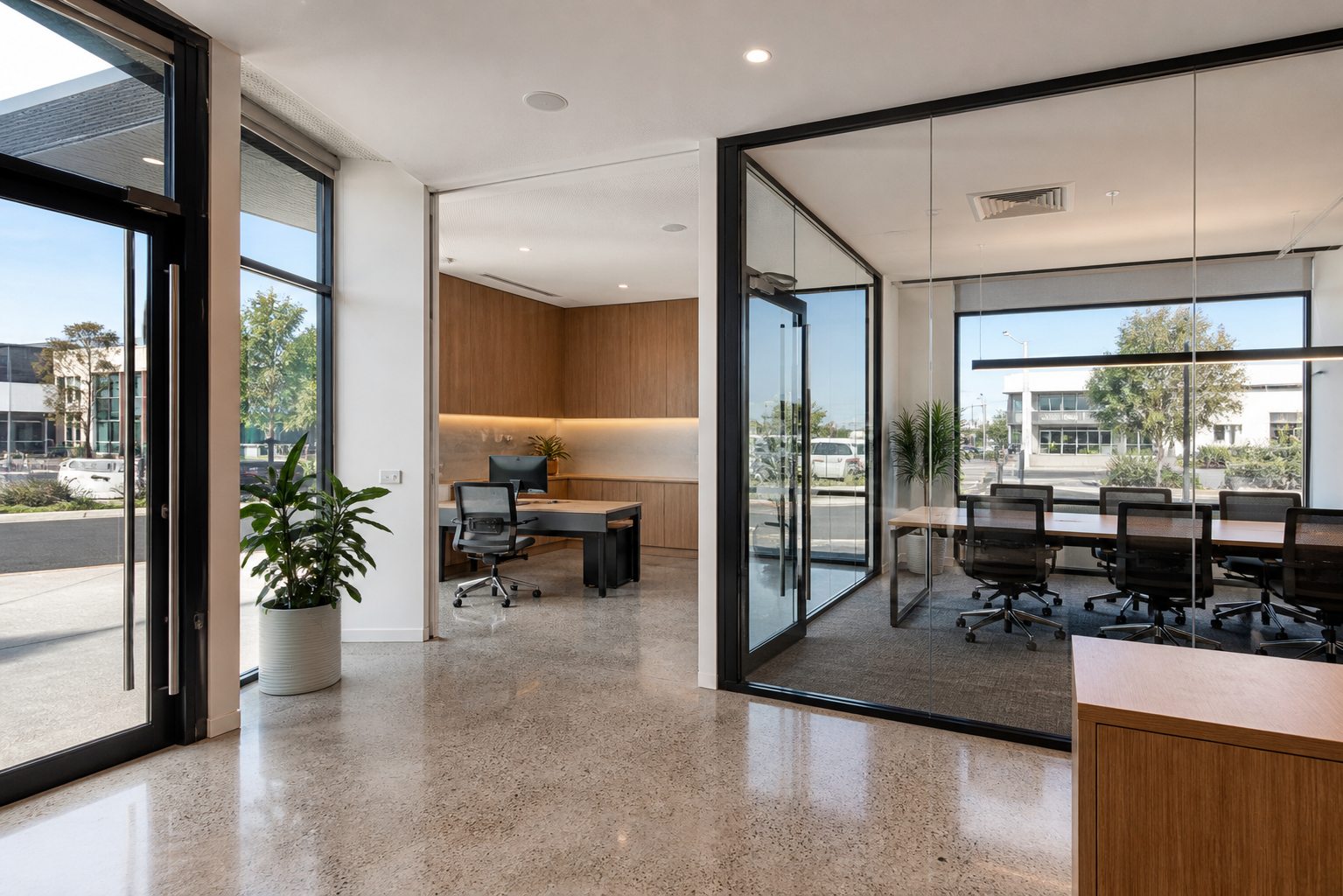 Illustrative modern street-level commercial office suite with meeting room